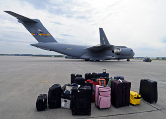 Luggage at airfield waiting to be transported to the airplane