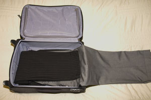 Trousers being folded into suitcase