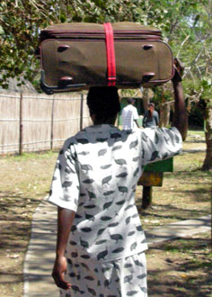 Woman carrying light luggage on her head